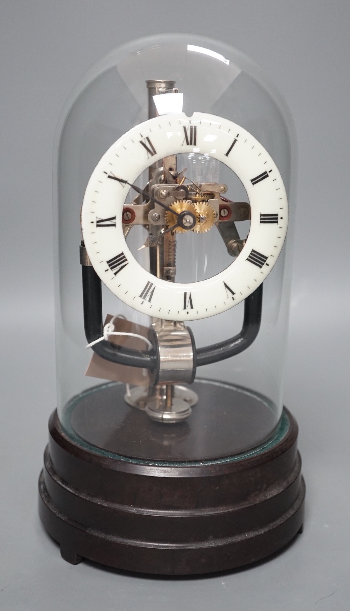 A 1930's electric mantel clock under glass dome, 26cms high